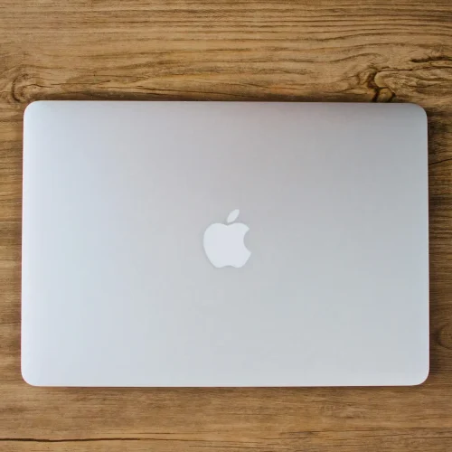 MacBook Air in wood desk