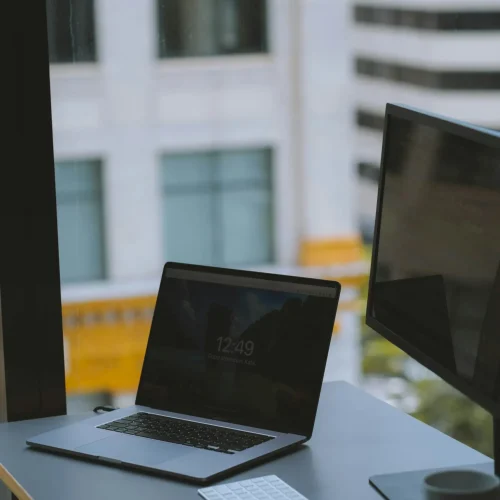 Macbook in the office with a view